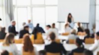 Business presentation background. Defocused image of people attending a lecture.