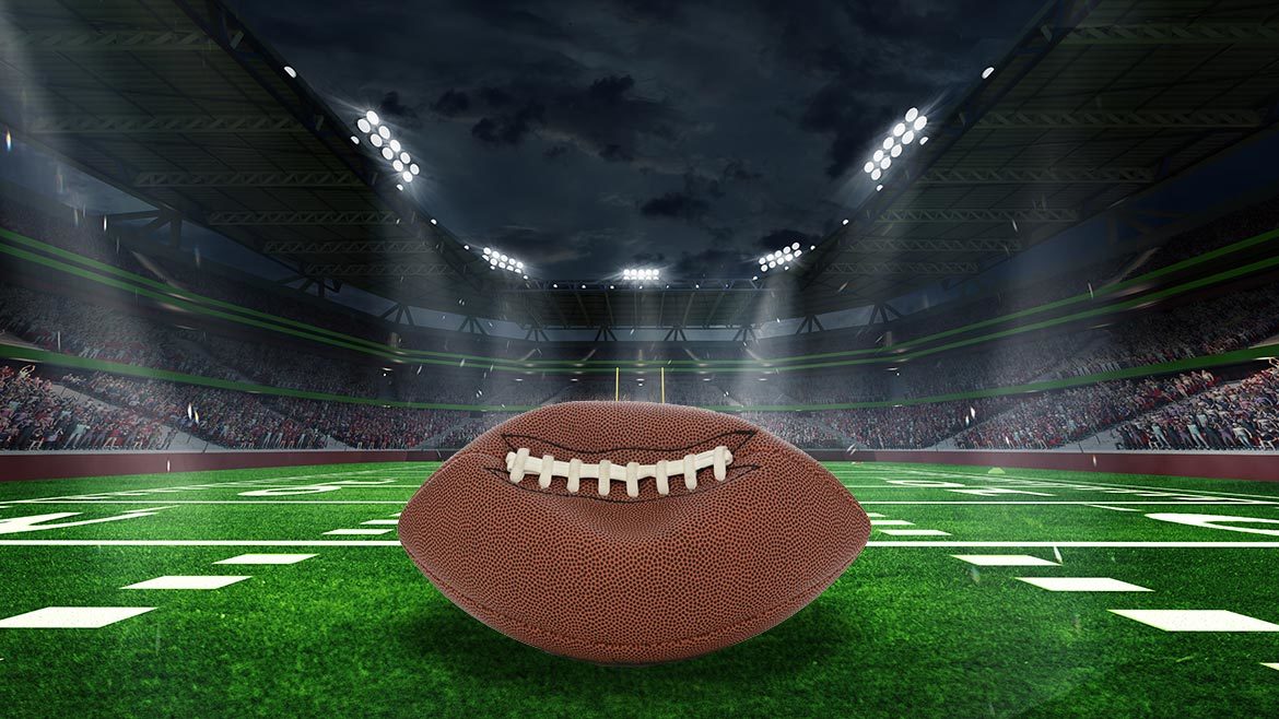 Unraveling Deflategate: Football stadium with closeup of football on field