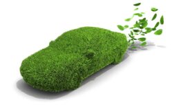 Grass-covered vehicle emitting green leaves with a white background.