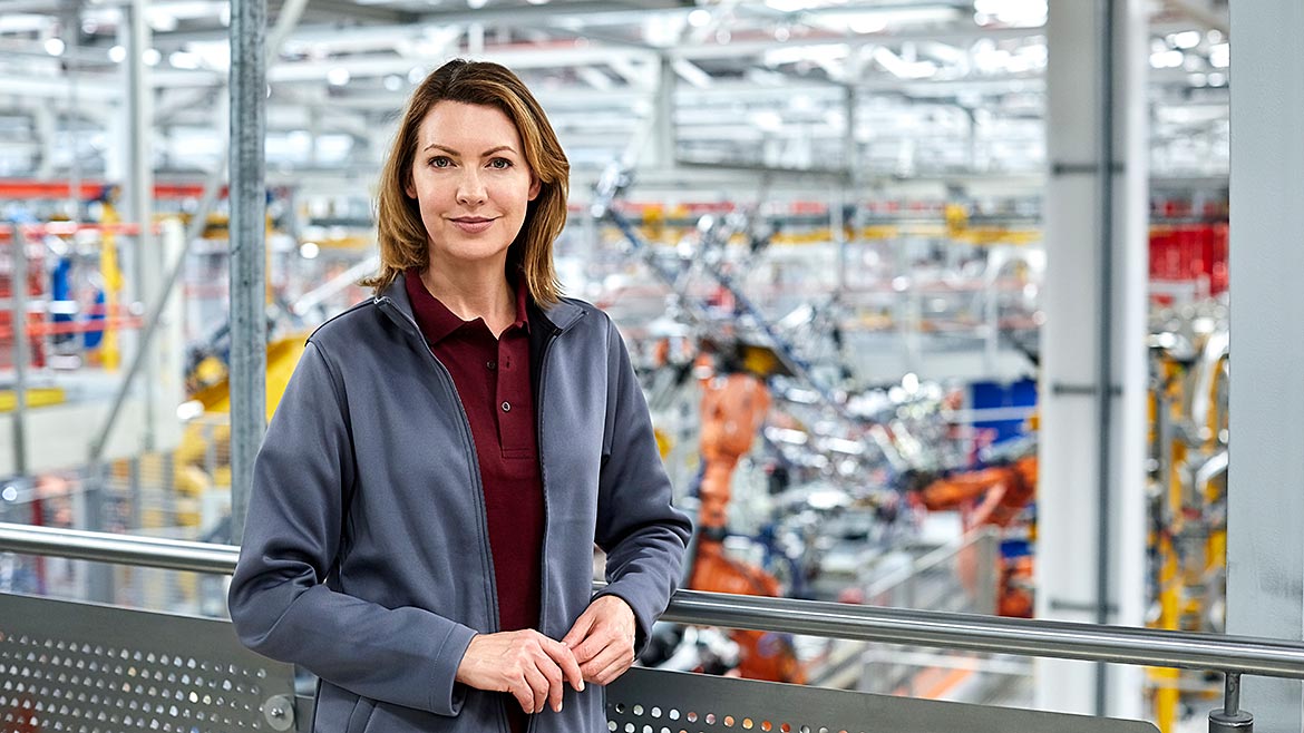 Female engineer standing in automobile industry.