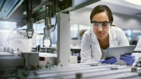 Shot of a young woman using a digital tablet while working in a laboratory.