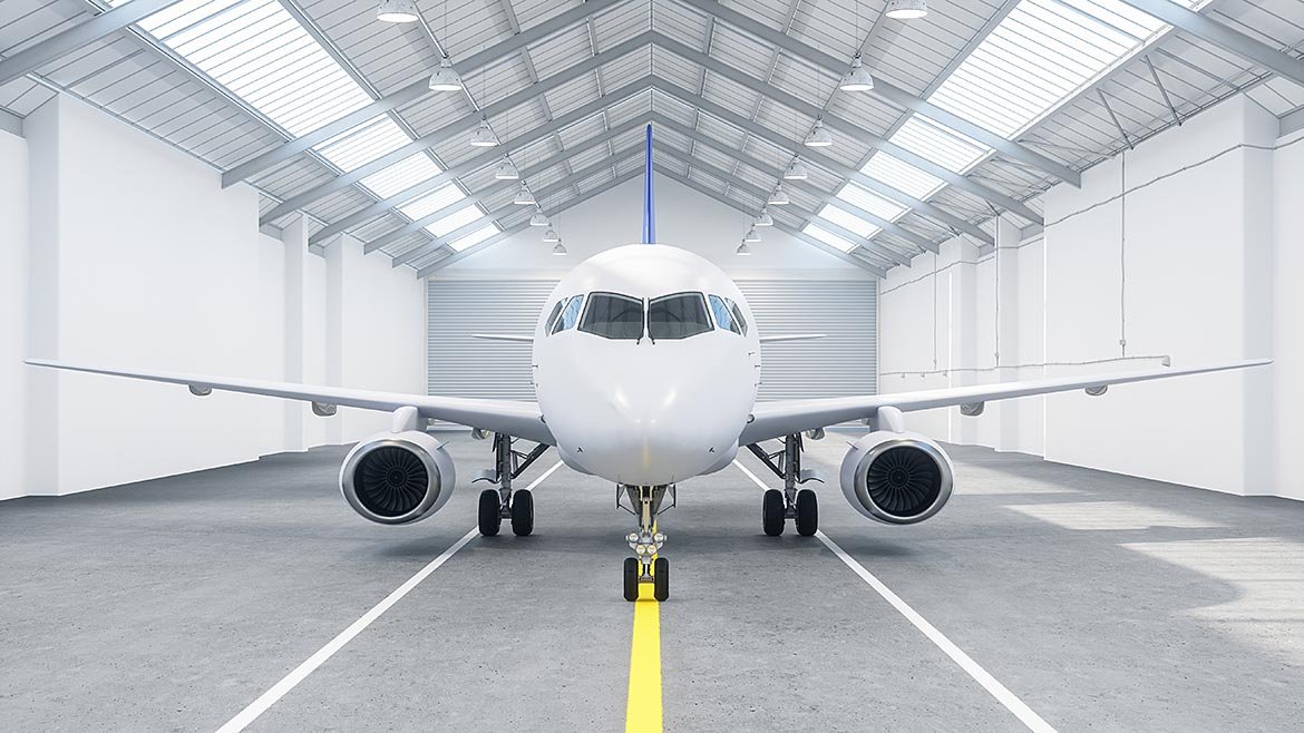 Airplane in a hangar at airport.