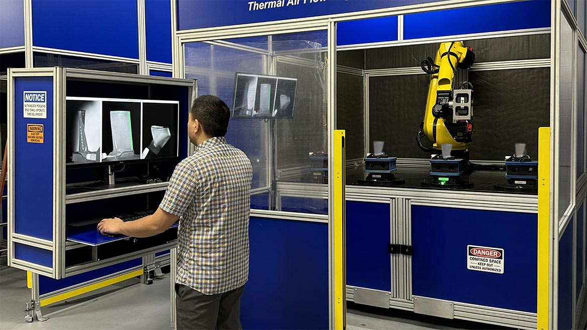 An operator reviews results of an automated AT inspection of aircraft turbine blades.