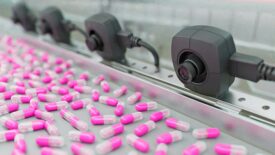 Counting capsules on a conveyor belt.