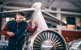 man and airplane engine