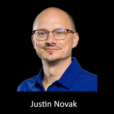 Justin Novak headshot with name.